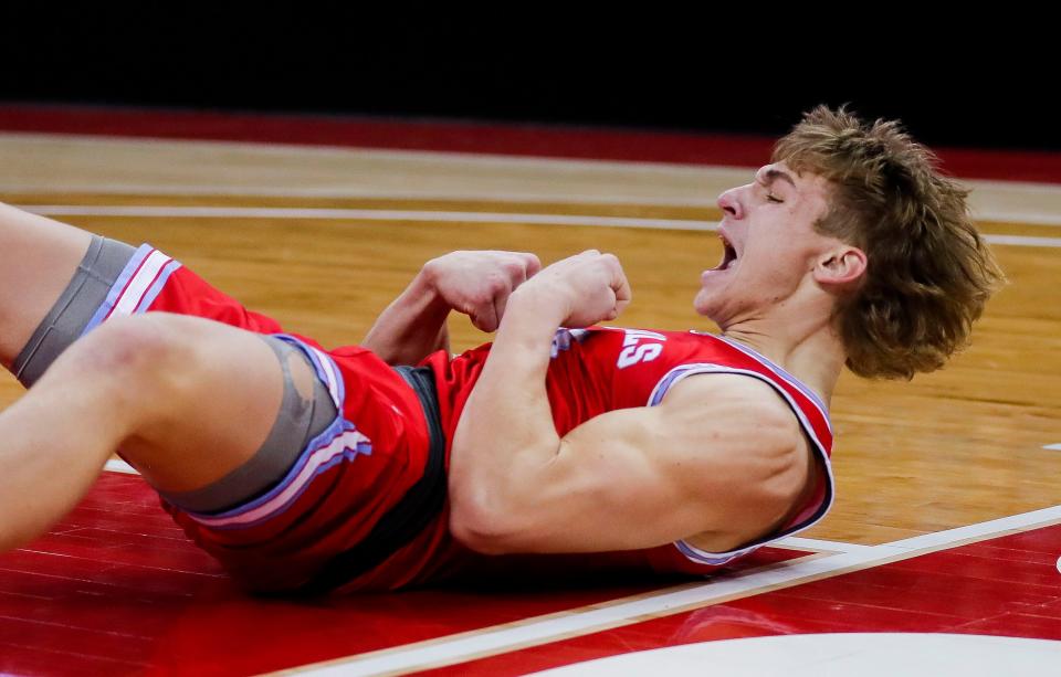 Newman Catholic High School's Conner Krach (10) reacts after being fouled on a made basket against Royall High School during a WIAA Division 5 state semifinal boys basketball game on Friday. Newman Catholic won the game, 52-42, to advance to the state final.