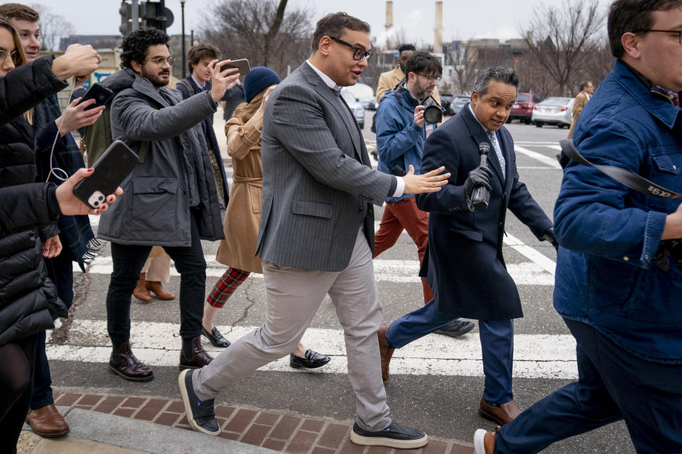 Rep. George Santos, R-N.Y., leaves a House GOP conference meeting on Capitol Hill in Washington, Wednesday, Jan. 25, 2023. (AP Photo/Andrew Harnik)