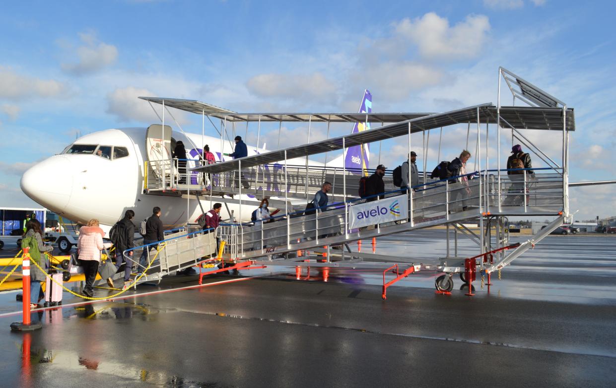 Passengers board the first Avelo flight from Wilmington Airport.