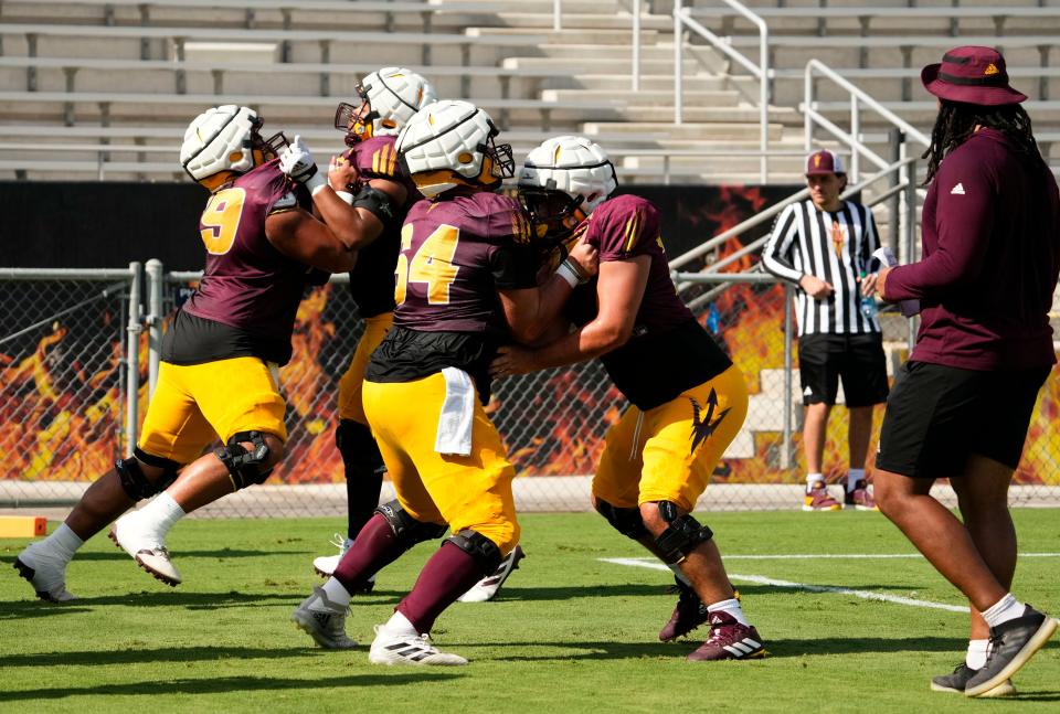 Arizona State offensive linemen Ben Bray (64) and Griffin Schureman (76) during football practice at Mountain America Stadium in Tempe on Aug. 8, 2023.