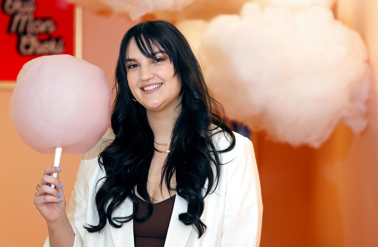 Art of Sucre Founder Emily Harpel poses for a portrait at her business Monday, Feb. 27, 2023, in Fairlawn, Ohio. Art of Sucre is best known for its cotton candy glitter bombs, which have gone viral on Tiktok.