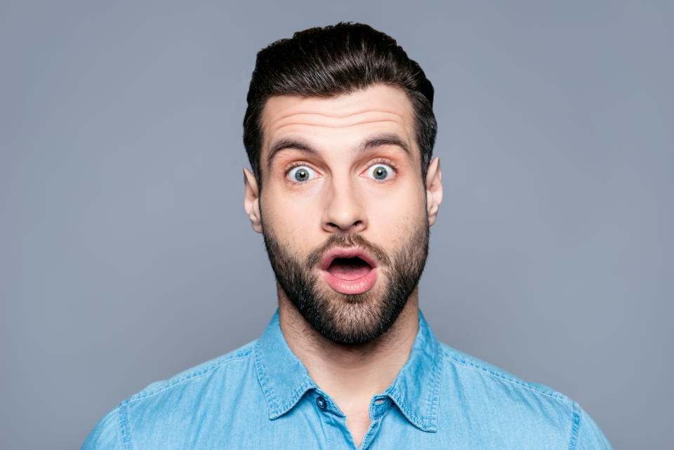 Man with raised eyebrows and surprised expression.