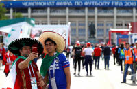 <p>Mexico fans take a selfie outside the stadium ahead of kick off. (Rex) </p>