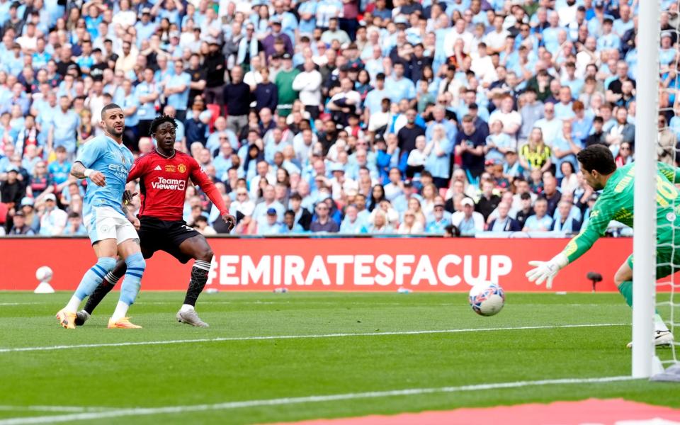 Kobbie Mainoo scores in the FA Cup final