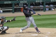 Cleveland Indians' Franmil Reyes hits a two-run home run against the Chicago White Sox during the fourth inning of a baseball game in Chicago, Saturday, Aug. 8, 2020. (AP Photo/Nam Y. Huh)