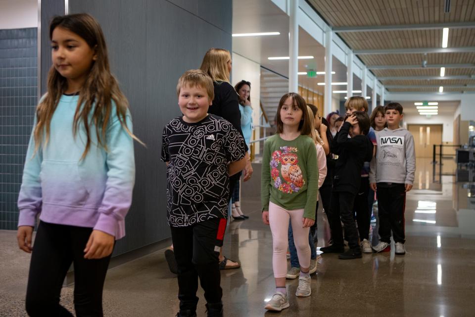Students line up after lunch before returning to class at the newly rebuilt Edison Elementary School Thursday, Oct. 20, 2022 in Eugene.