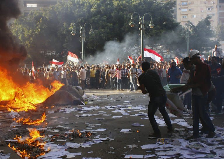 Opponents of Egyptian President Mohamed Morsi burn the contents of a Freedom and Justice Party office in the coastal city of Alexandria on June 28, 2013. Washington warned against travel to Egypt after an American was among three people killed during rival demonstrations for and against Morsi ahead of Sunday's anniversary of his turbulent maiden year in office