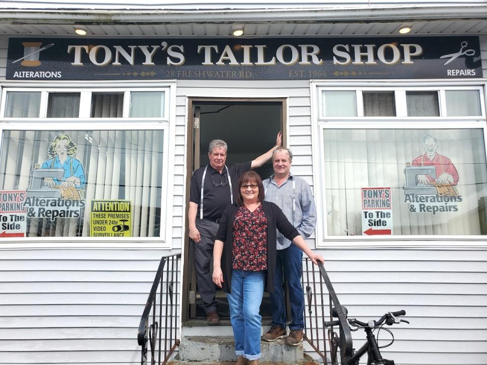 Tony Jr., Theresa and Mike on the steps of Tony's Tailor Shop, the business founded by their father 60 years ago. on Freshwater Road; Photo by Susan Flanagan
