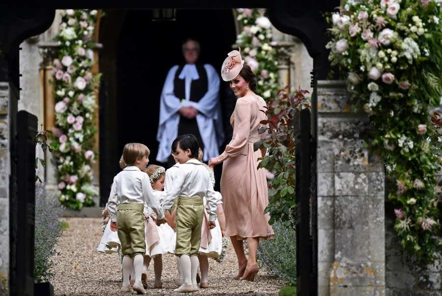 FILE – Britain’s Catherine, Duchess of Cambridge, right, walks with the bridesmaids and pageboys as they arrive for her sister Pippa Middleton’s wedding to James Matthews, at St Mark’s Church in Englefield, England, Saturday, May 20, 2017. (Justin Tallis/Pool Photo via AP, File)