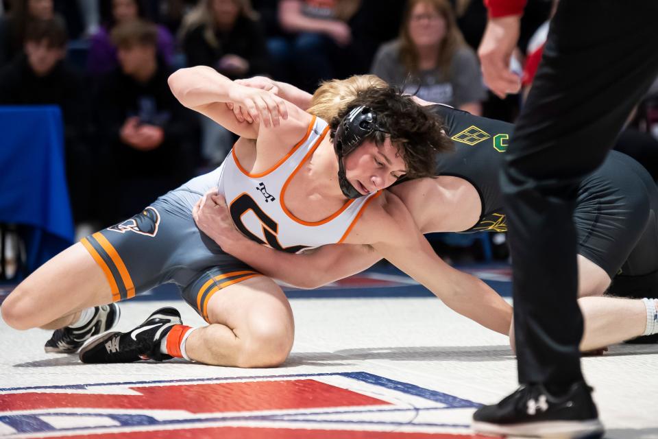 Central York's Eli Long (left) works for a reversal on Central Dauphin's Gavin Reynolds in the 145-pound championship bout at the PIAA District 3 Class 3A Wrestling Championships at Spring Grove Area High School on Saturday, Feb. 24, 2024, in Jackson Township.