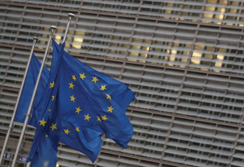 EU flags flutter outside the European Commission headquarters in Brussels