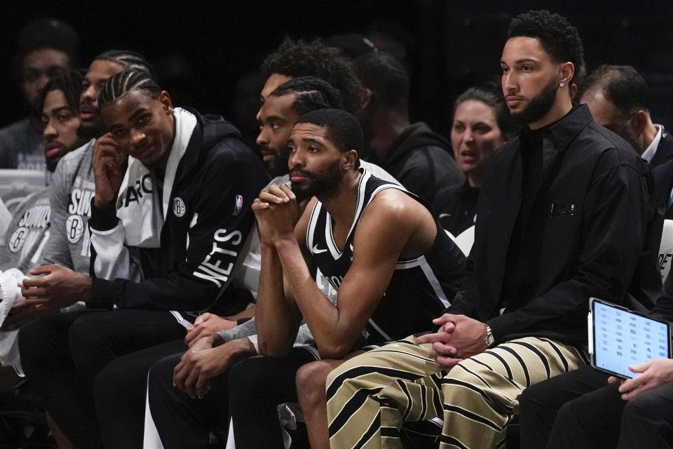 Brooklyn Nets' Ben Simmons, right, watches with teammates during the first half of an NBA basketball game against the Memphis Grizzlies, Monday, March 4, 2024, in New York. (AP Photo/Frank Franklin II)