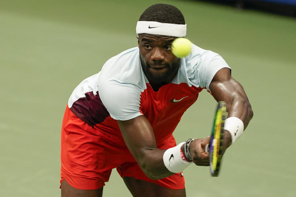 Frances Tiafoe, of the United States, returns a shot to Andrey Rublev, of Russia, during the quarterfinals of the U.S. Open tennis championships, Wednesday, Sept. 7, 2022, in New York. (AP Photo/Seth Wenig)