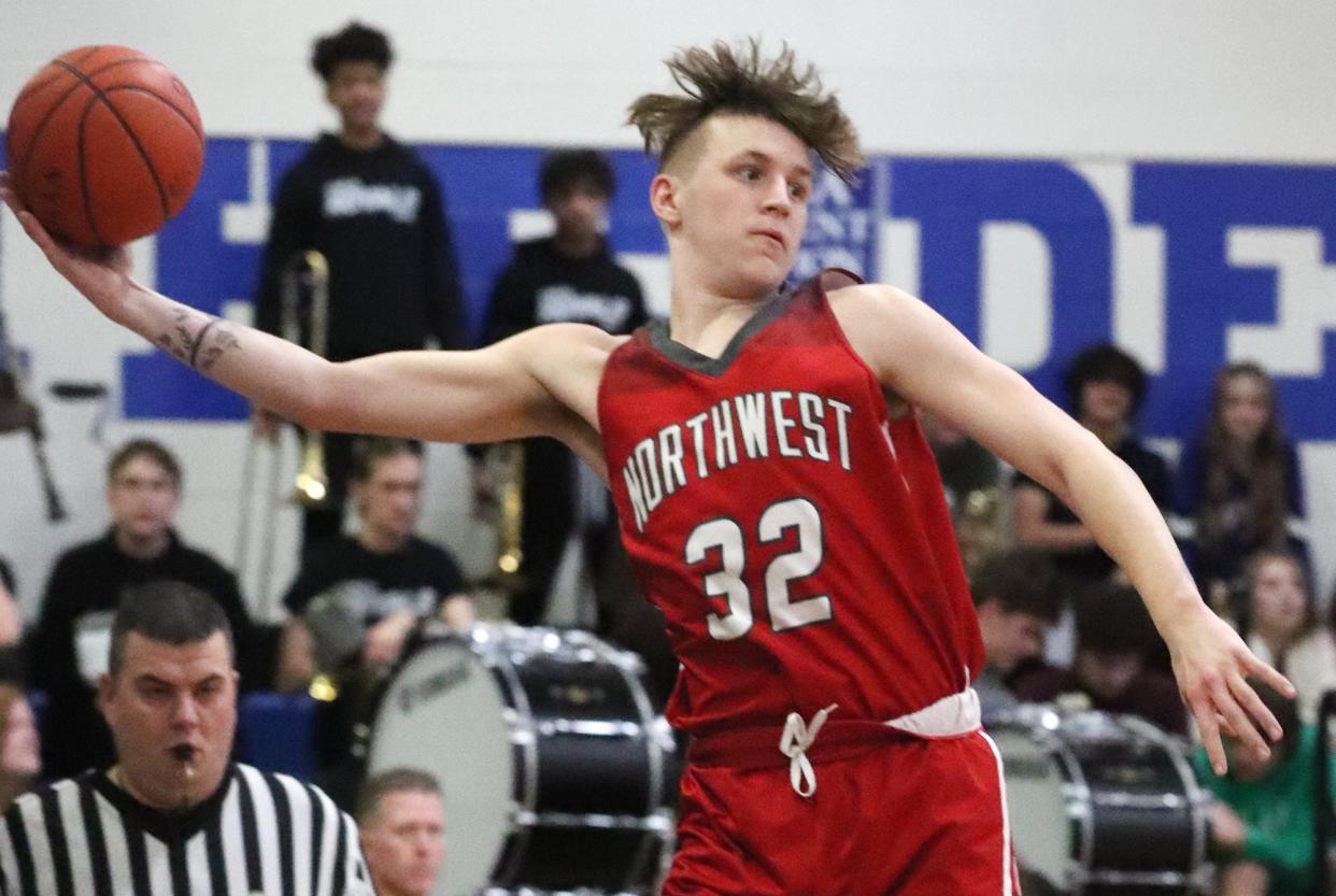 Northwest's Ian Ziegler keeps the ball from going out of bounds against CVCA during their game in Tim Beyerle Memorial Gymnasium at Cuyahoga Valley Christian Academy on Tuesday.