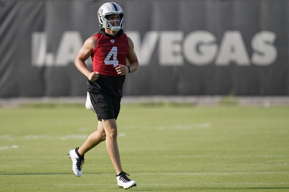 Las Vegas Raiders quarterback Derek Carr (4) runs during an NFL football practice Tuesday, June 15, 2021, in Henderson, Nev. (AP Photo/John Locher)