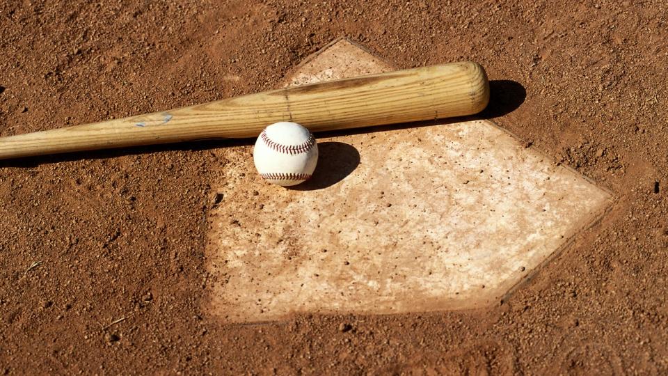 <div>Model Released: Baseball bat and ball on base plate (Photo by Markus Boesch/Getty Images)</div>