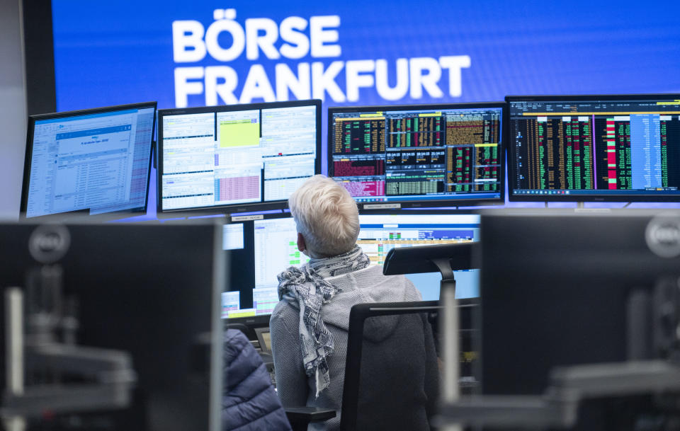 04 November 2020, Hessen, Frankfurt/Main: A trader sits in the trading room of the Frankfurt Stock Exchange in front of her monitors, which also show reports on the election of the US president. Photo: Frank Rumpenhorst/dpa (Photo by Frank Rumpenhorst/picture alliance via Getty Images)