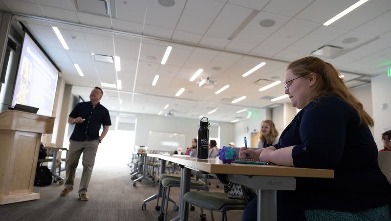Rachel Leonard takes notes as adjunct professor Jared Stewart teaches at the Melisa Nellesen Center for Autism in Orem on April 3. A report highlights gaps in services for adults with autism in Utah.