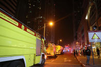 <p>Fire trucks arrive after a blaze started at the 1,105 foot tall Torch tower skyscraper on August 4, 2017 in Dubai. (Photo: Karim Sahib/AFP/Getty Images) </p>