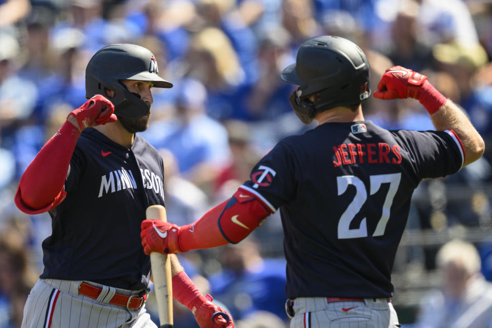 Minnesota Twins first baseman Joey Gallo, left, celebrates with teammate Ryan Jeffers (27) after hitting a home run against the Kansas City Royals during the sixth inning of a baseball game, Sunday, April 2, 2023, in Kansas City, Mo. (AP Photo/Reed Hoffmann)