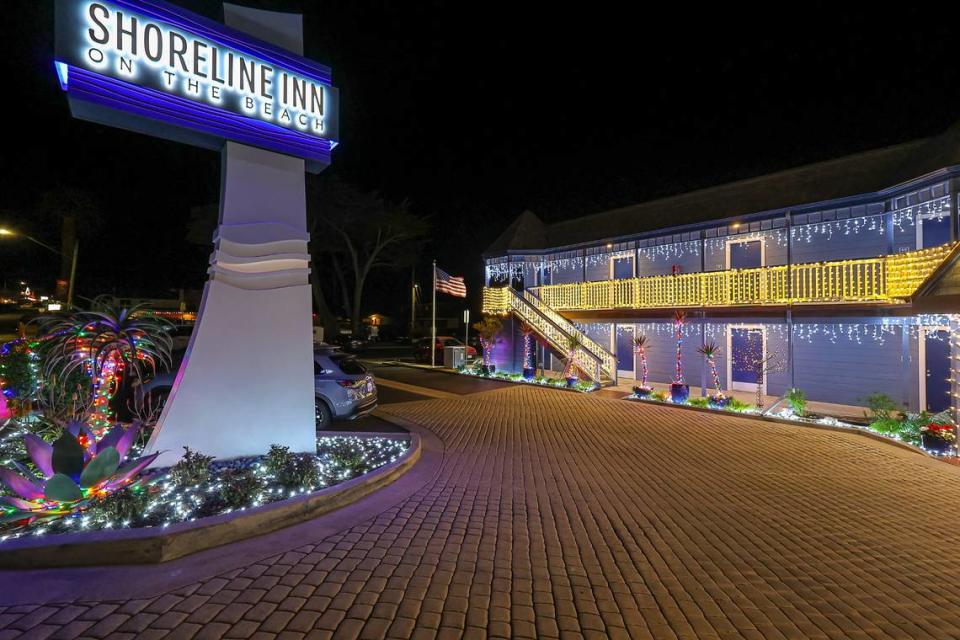 Holiday lights illuminate Shoreline Inn at the Beach in Cayucos in 2023. The San Luis Obispo County hotel is decorated with more than 25,000 lights along with a snowman display and reindeer grazing on the lawn