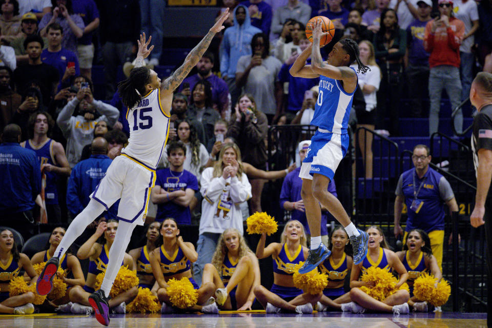 Kentucky guard Rob Dillingham (0) shoots against LSU forward Tyrell Ward (15) during the second half of an NCAA college basketball game in Baton Rouge, La., Wednesday, Feb. 21, 2024. (AP Photo/Matthew Hinton)