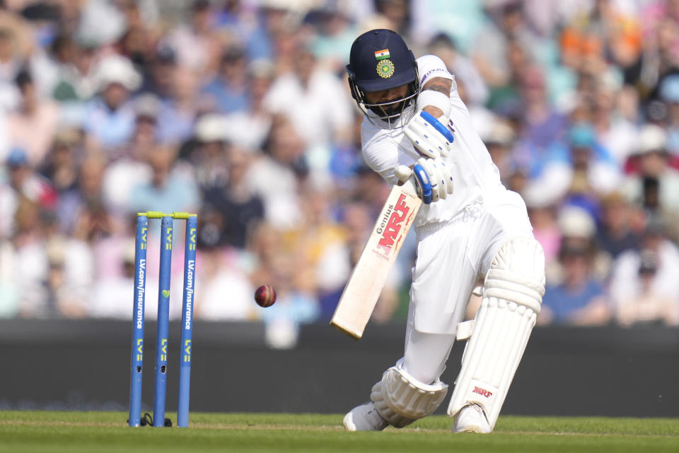 India's Virat Kohli plays a shot for four off the bowling of England's James Anderson on day four of the fourth Test match at The Oval cricket ground in London, Sunday, Sept. 5, 2021. (AP Photo/Kirsty Wigglesworth)