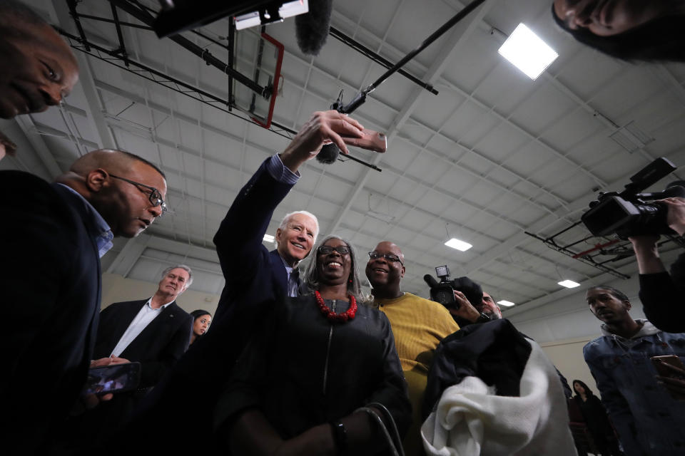 Democratic presidential candidate former Vice President Joe Biden takes photos with supporters after speaking at a campaign event in Sumter, S.C., Friday, Feb. 28, 2020. (AP Photo/Gerald Herbert)