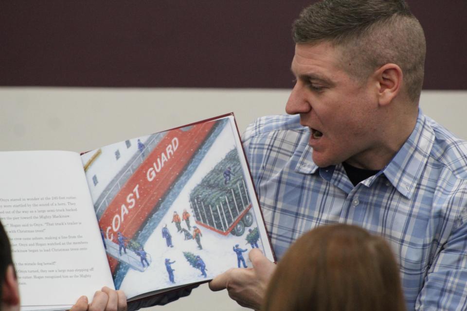 Earlier this year, Tyler Benson,  United States Coast Guard Chief and children's author, who had been stationed on the United States Coast Guard Cutter Mackinaw and is currently stationed in St. Ignace, was at Cheboygan Area Public Library to read his book to fans. Tribune File Photo by Kortny Hahn