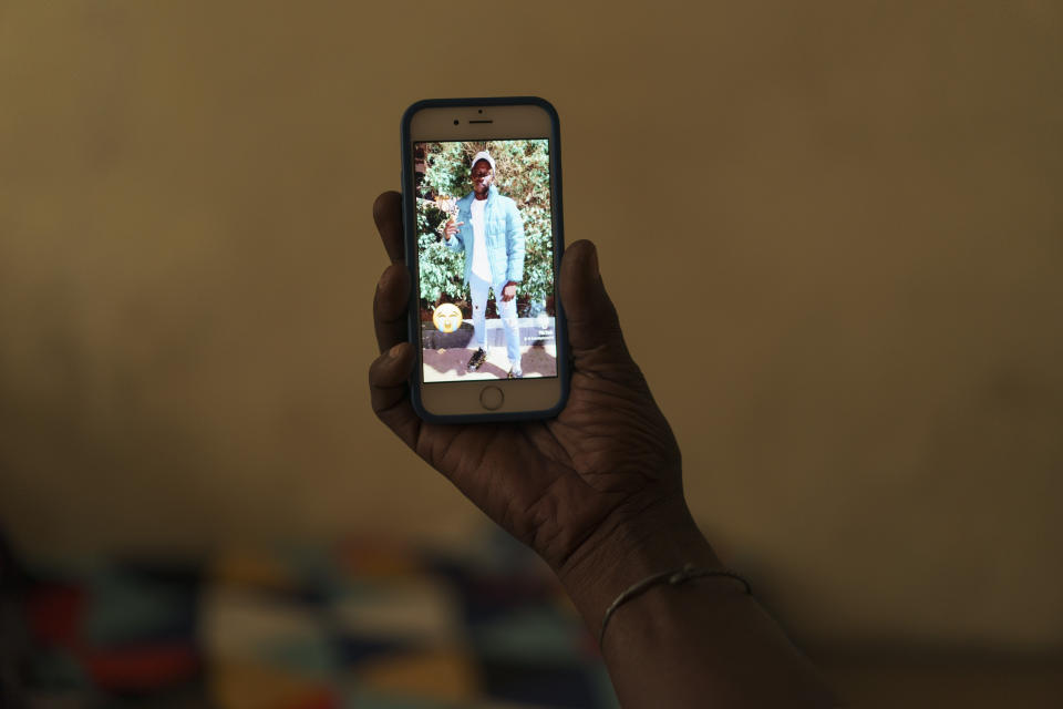 Ibrahima Ba shows, on a mobile phone, a picture of his son Khadim Ba, 21, who died during the protests earlier this month in Dakar, Senegal, Thursday, June 15, 2023. (AP Photo/Leo Correa)