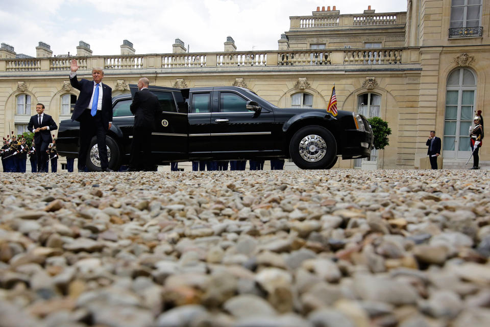 <p>French President Emmanuel Macron, left, walks as President Donald Trump waves before a meeting at the Elysee Palace in Paris, Thursday, July 13, 2017. (Photo: Markus Schreiber/AP) </p>