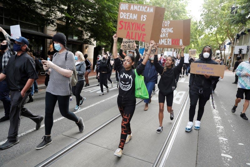 FILE PHOTO: Protesters rally against the death in Minneapolis police custody of George Floyd, in Portland, Oregon, U.S. May 31, 2020. REUTERS/Terray Sylvester/File Photo