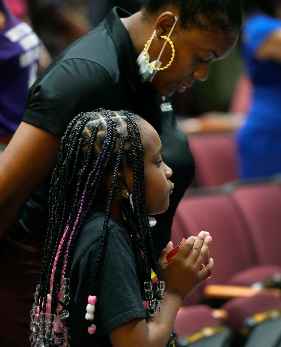 A youngster watches with reverence at a gathering at Bethune-Cookman University on Wednesday as the historic statue of Mary McLeod Bethune was unveiled in Statuary Hall in the U.S. Capitol in Washington, D.C.