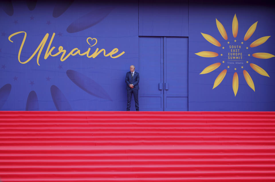 A security member guards outside a building during a summit of Southeastern European countries on peace in Tirana, Albania, Wednesday, Feb. 28, 2024. Ukraine's president will co-host a summit with Albania's government on Wednesday that is meant to encourage further support for Kyiv by southeastern European countries, as signs of fatigue grow two years after Russia's full-scale invasion. (AP Photo/Armando Babani)