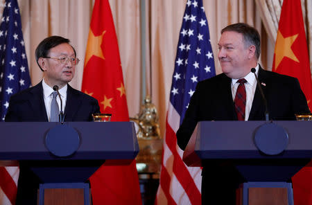 U.S. Secretary of State Mike Pompeo listens to Chinese Communist Party Office of Foreign Affairs Director Yang Jiechi speak as the two countries hold a joint news conference after participating in a second diplomatic and security meeting at the U.S. Department of State, Washington, U.S., November 9, 2018. REUTERS/Leah Millis