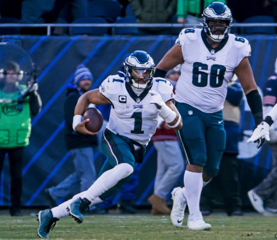 Mailata watches as Eagles quarterback Jalen Hurts runs the ball at Soldier Field in December.