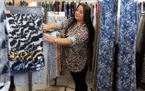 An employee works on garments at a textile factory in Istanbul