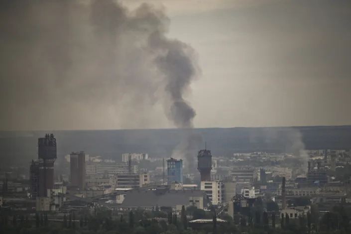 A plume of smoke rises, casting a pall over the city of Severodonetsk.