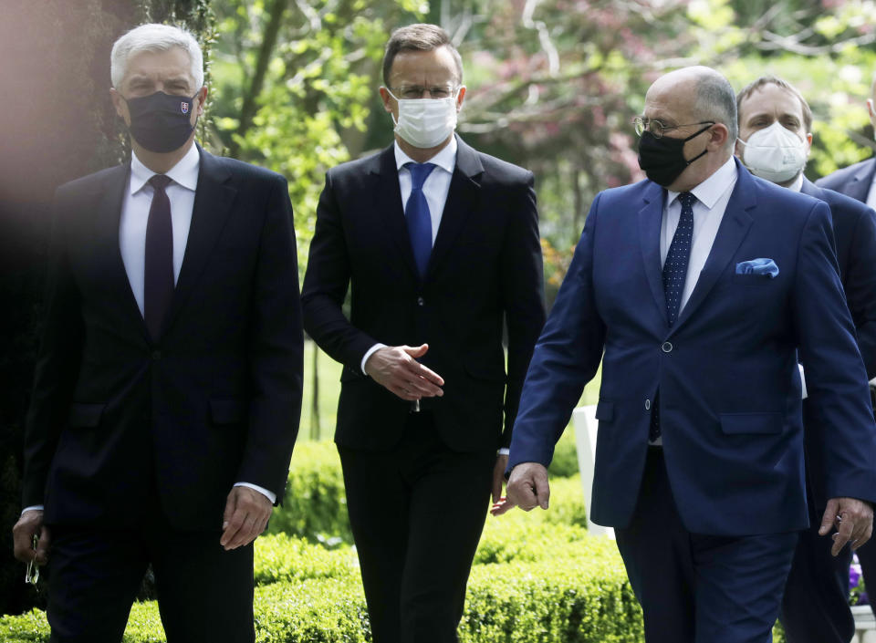 Slovak Foreign Minister Ivan Korcok, left, Polish Foreign Minister Zbigniew Rau ,Hungarian Foreign Minister Peter Szijjarto and Czech Republic Foreign Minister Tomas Petricek ,right, after the foreign ministers of the Visegrad Group V4, meeting in Lodz, Poland, Friday, May 14, 2021.(AP Photo/Czarek Sokolowski)