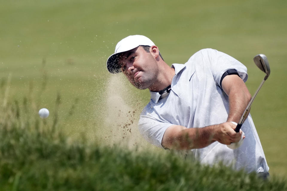 Scottie Scheffler hits from a bunker to the 17th green during a practice round of the U.S. Open golf tournament at Los Angeles Country Club, Monday, June 12, 2023, in Los Angeles. (AP Photo/Marcio Jose Sanchez)