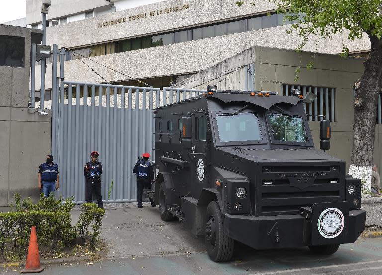 Mexican Federal Police stand guard outside the General Prosecutor's office in Mexico City on February 27, 2015