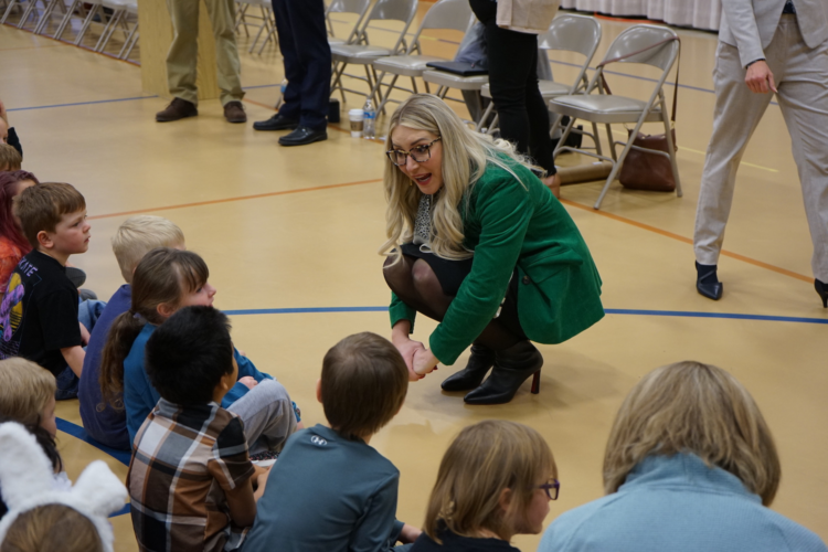 Wyoming Superintendent of Public Instruction Megan Degenfelder talks to students in grades 1-3 at Gannett Peak Elementary in Lander on March 19, 2024. (Katie Klingsporn/WyoFile)