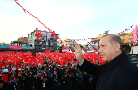 Turkish President Tayyip Erdogan greets his supporters during an opening ceremony of a new metro line in Istanbul, Turkey December 15, 2017. Kayhan Ozer/Presidential Palace/Handout via REUTERS