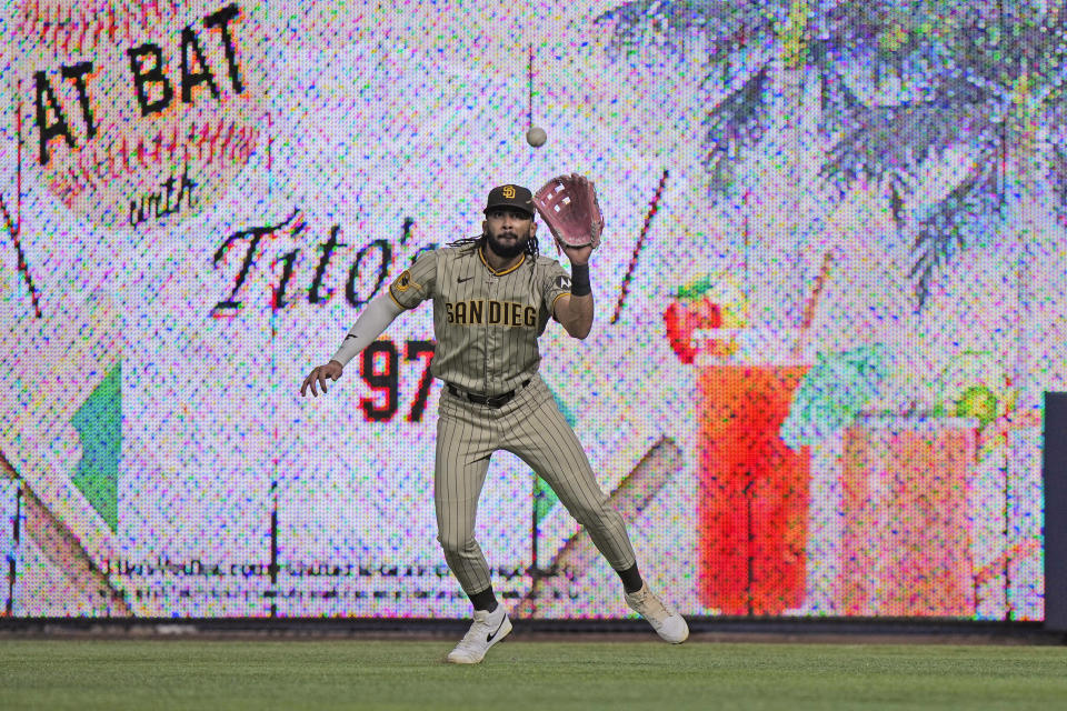 San Diego Padres right fielder Fernando Tatis Jr. catches a ball hit by Miami Marlins' Yuli Gurriel during the fourth inning of a baseball game, Wednesday, May 31, 2023, in Miami. (AP Photo/Wilfredo Lee)