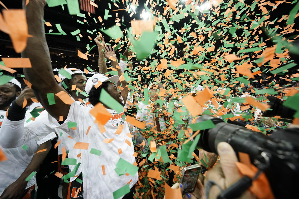 Miami celebrates after their win against Texas in an Elite 8 college basketball game in the Midwest Regional of the NCAA Tournament Sunday, March 26, 2023, in Kansas City, Mo. (AP Photo/Charlie Riedel)