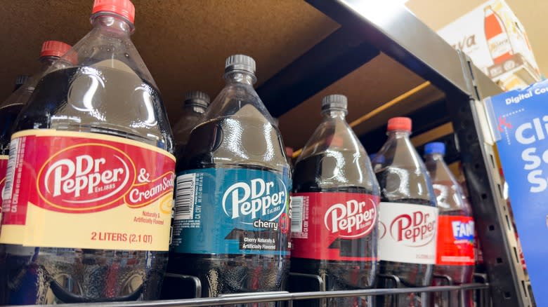different flavors of dr pepper bottles on shelf at store