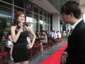 The 171cm tall lady answers the emcee's question while the audience listens intently. (Yahoo! Singapore/ Deborah Choo)