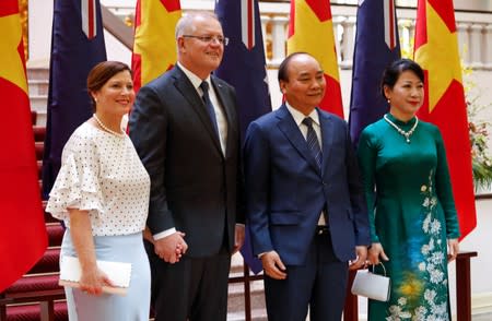 Australia's Prime Minister Scott Morrison and his wife Jenny pose for a photo with his Vietnamese counterpart Nguyen Xuan Phuc and wife Tran Nguyet Thu in Hanoi