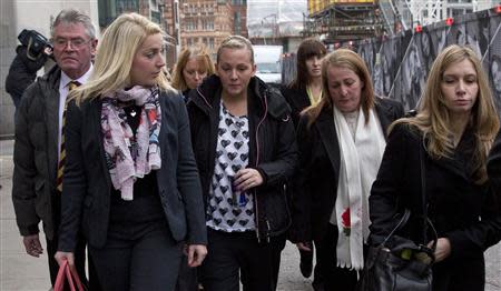 The family of murdered soldier Lee Rigby arrive at the Old Bailey in London, November 29, 2013. REUTERS/Neil Hall