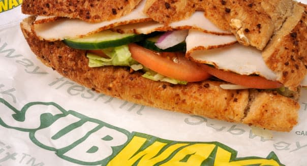 Subway turkey submarine sandwich on wrapper with subway logo USA.